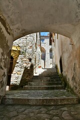 Fototapeta premium A small street between the old houses of Zungoli, one of the most beautiful villages in Italy.