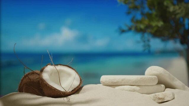 Stone podium for demonstration of natural coconut cosmetics on sand beach. Placement for presentation of beauty products