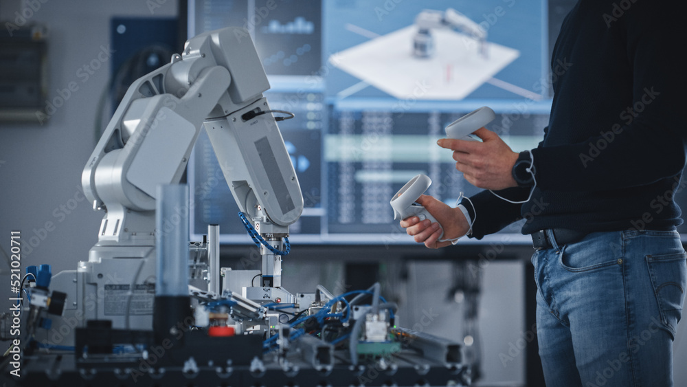 Poster Unrecognisable Male Student Holding Virtual Reality Controllers, Uses New Technology for Industrial Design, Development, Prototyping in Robotics. High Tech Concept In Modern University Classroom.