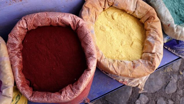 Bags with color dye pigments in the Medina of Chefchaouen (Chaouen), Morocco. Popular travel destination of Morocco. 4k footage. 