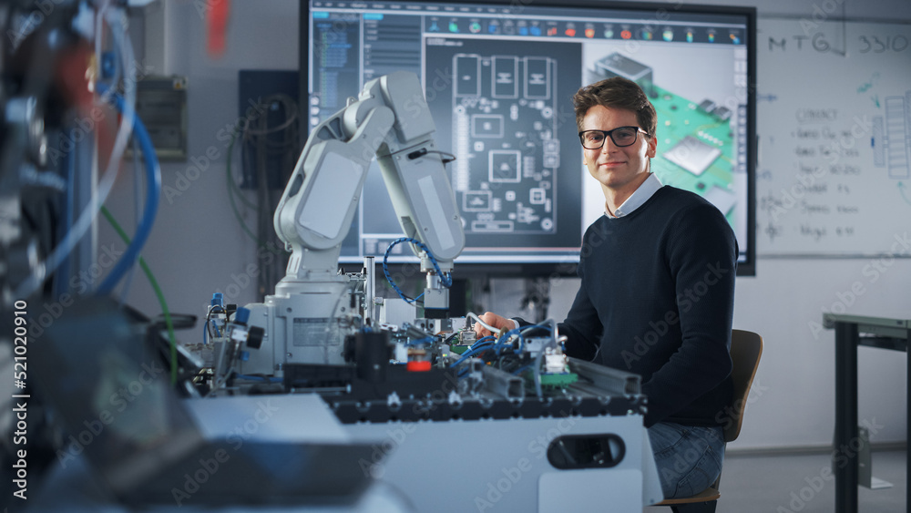 Aufkleber Portrait of Smiling Engineer Using Screwdriver while Working with Microchip of Robotic Arm. Student Holding an Experiment with Bionic Arm. High-Tech Science, Education and Engineering Concept