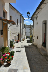 Fototapeta na wymiar A small street between the old houses of Zungoli, one of the most beautiful villages in Italy.