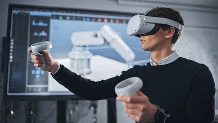 Student Engineer Wearing Virtual Reality Headset Holding Joysticks and Controlling Bionic Limb While Actions Displayed on Screen. Modern Equipment and Computer Science Education in University Concept.