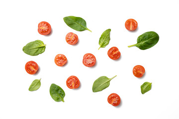 Composition with cherry tomatoes on white and basil leaves on white background