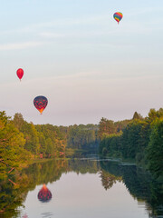 color hot air balloon in blue sky and cloud nature background