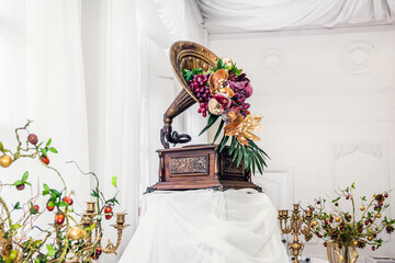 Retro gramophone decorated with fruit at a wedding banquet, decorating a buffet table