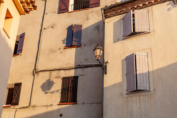 Fototapeta na wymiar Old european village building with the light shadows