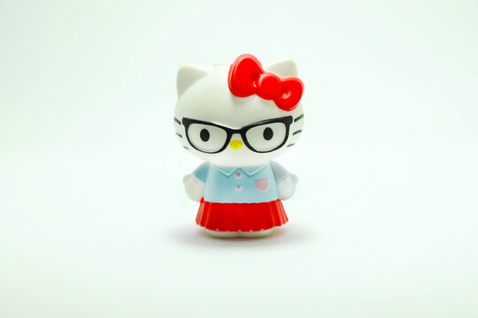 Hello Kitty with black glasses. Doll. Plastic figure. Famous character. Adorable kitten. Character from Japan. Sanrio. 