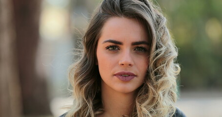 Portrait of serious pretty woman starring to camera