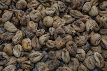 Dry figs seen in drying process.