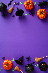 Happy Halloween holiday concept. Halloween decorations, pumpkins, bats, witch hats, brooms on...
