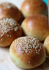 Home made burger buns close up photo. Sourdough bread on a table. Eating healthy concept. 