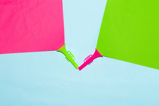 green trumpet with pink light and pink trumpet with green light, creative art design

