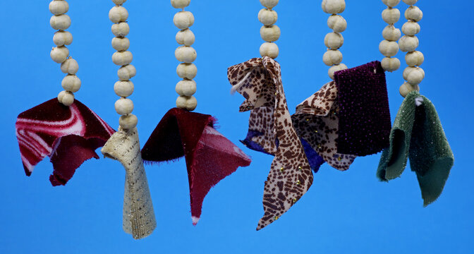 amulet wall decoration made of peganum harmala and fabric pieces
