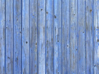 a light blue painted washed out plank wall