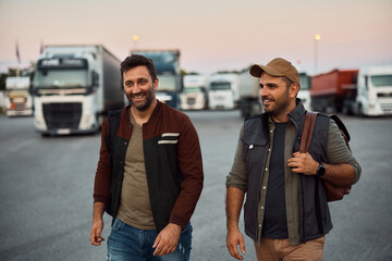 Happy truck drivers leaving parking to after work.