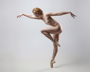 charming ballerina posing in the studio on a white background - obrazy, fototapety, plakaty
