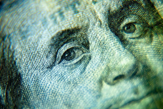 Close up Benjamin Franklin on one hundred US Dollar bill. Macro image.