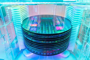 patterned silicon wafers in a universal pod. Electronic circuit designs have been built onto the wafers using micromaching including photolithography