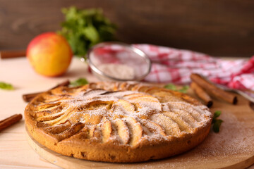 Appetizing pie close-up on a wooden background