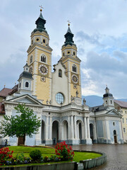 Fototapeta na wymiar Grand and beautiful Catholic Cathedral with double towers in Bressanone, Italy
