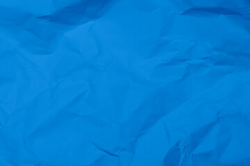 Blue crumpled paper texture background. Blue wrinkled paper texture background. Blue crease fabric texture background. Blue wrinkled fabric texture background.