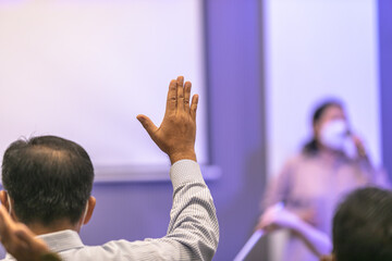 Naklejka na ściany i meble Singing together, raising hands to worship Jesus in the church
