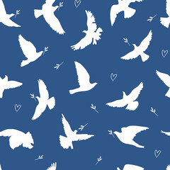 Flying birds silhouettes seamless pattern. Doves of peace silhouettes vector pattern	