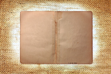 Vintage Grungy Book Pages on Burlap Background