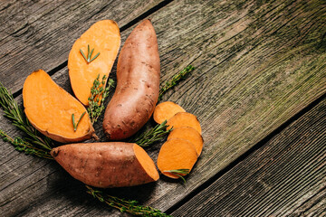 Organic orange sweet potato. Raw sweet potatoes or batatas. vegan food ingredient. banner, menu, recipe place for text, top view