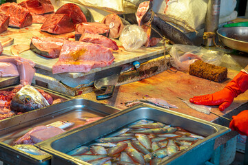 cook on fish kitchen , lifestyle of a marine restaurant worker closeup