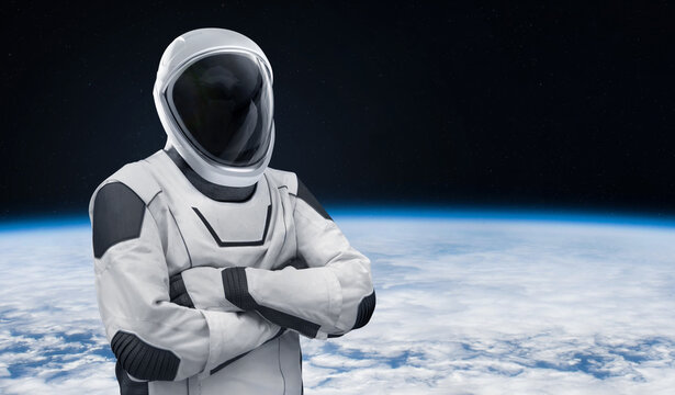 Astronaut in modern new spacesuit in space near Earth. Space collage with spacex spaceman. Elements of this image furnished by NASA