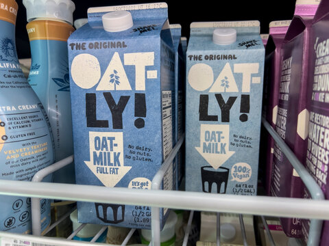 Everett, WA USA - circa August 2022: Angled, selective focus on Oatly milk alternative products for sale inside an Albertsons grocery store