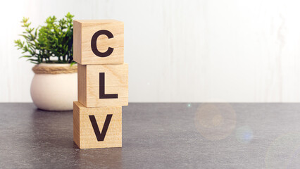 text CLV on wooden dice standing on top of each other
