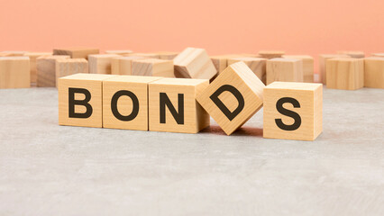 word Bonds made with wood blocks. text is written in black letters, light background