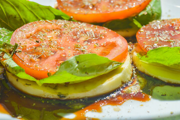Fresh Italian caprese salad close up with red, green and white dominant colors