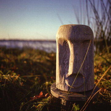 old wooden tiki at sunset