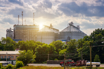 Grain storage silos. Galvanized tanks for grain. Granary with mechanical equipment for receiving © Sergii