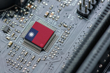 Flag of the Republic of China or Taiwan on a processor, CPU Central processing Unit or GPU microchip on a motherboard. Taiwan manufacturing chip industry emerges as battlefront in US - China showdown.