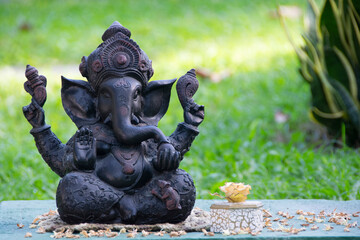 Ganesha statue isolated in the garden background