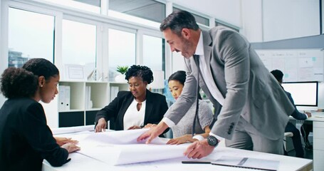 Architect engineers having a group meeting to create a creative blueprint strategy. Serious design colleagues working together in collaboration planning their new office construction project