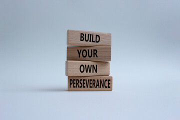 Perseverance symbol. Wooden blocks with words 'Build your own Perseverance'. Beautiful white background. Business and 'Build your own Perseverance' concept. Copy space.
