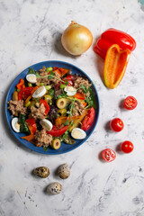 nicoise salad on the table with vegetables top view