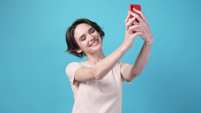 Lady making selfie portrait gadget isolated on blue color background