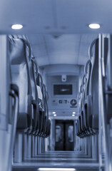 Obraz premium Aisle with seats in double decker train.