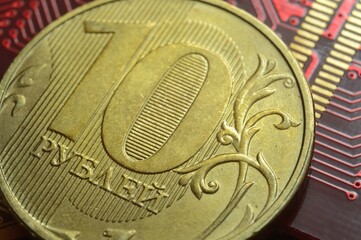 Russian coin with a face value of 10 rubles. lies among the microcircuits. (the concept of the digital economy of Russia)