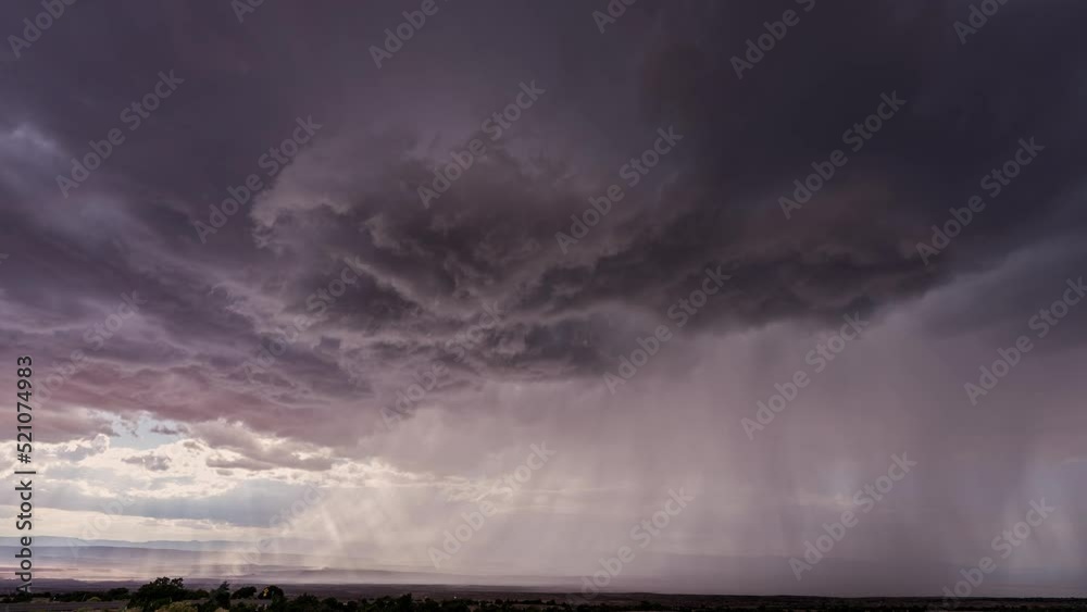 Wall mural dark clouds rotating in the sky in front of monsoon storm in utah moving through the desert.