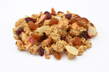 granola muesli with dried berries and fruits on a white background close-up