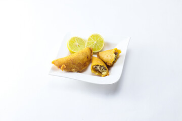 corn empanada typical Colombian food with lemon and copy space