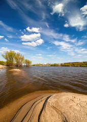 Landscape with the shore of Oka river at the mouth of Moscow river, sky and clouds, Kolomna city, Moscow region, Russia